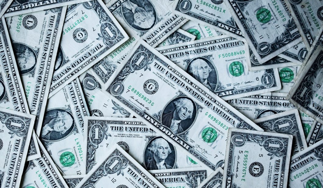 Image of U.S. dollar bills in a circular design.