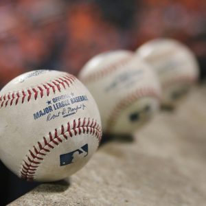 Baseballs lined up. Many sports fans aren't able to watch their favorite teams on local cable, due to botched negotiations between Bally Sports and Comcast/Xfinity.