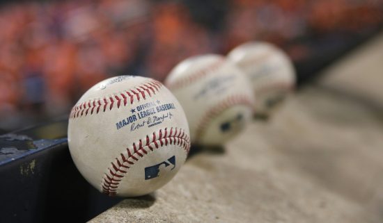 Baseballs lined up. Many sports fans aren't able to watch their favorite teams on local cable, due to botched negotiations between Bally Sports and Comcast/Xfinity.