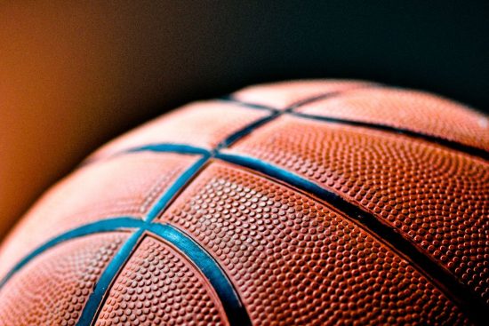 Basketball through the hoop.