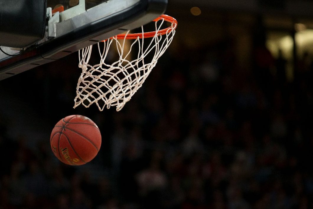 Basketball through the hoop.