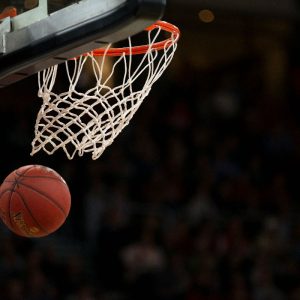 Basketball through the hoop.